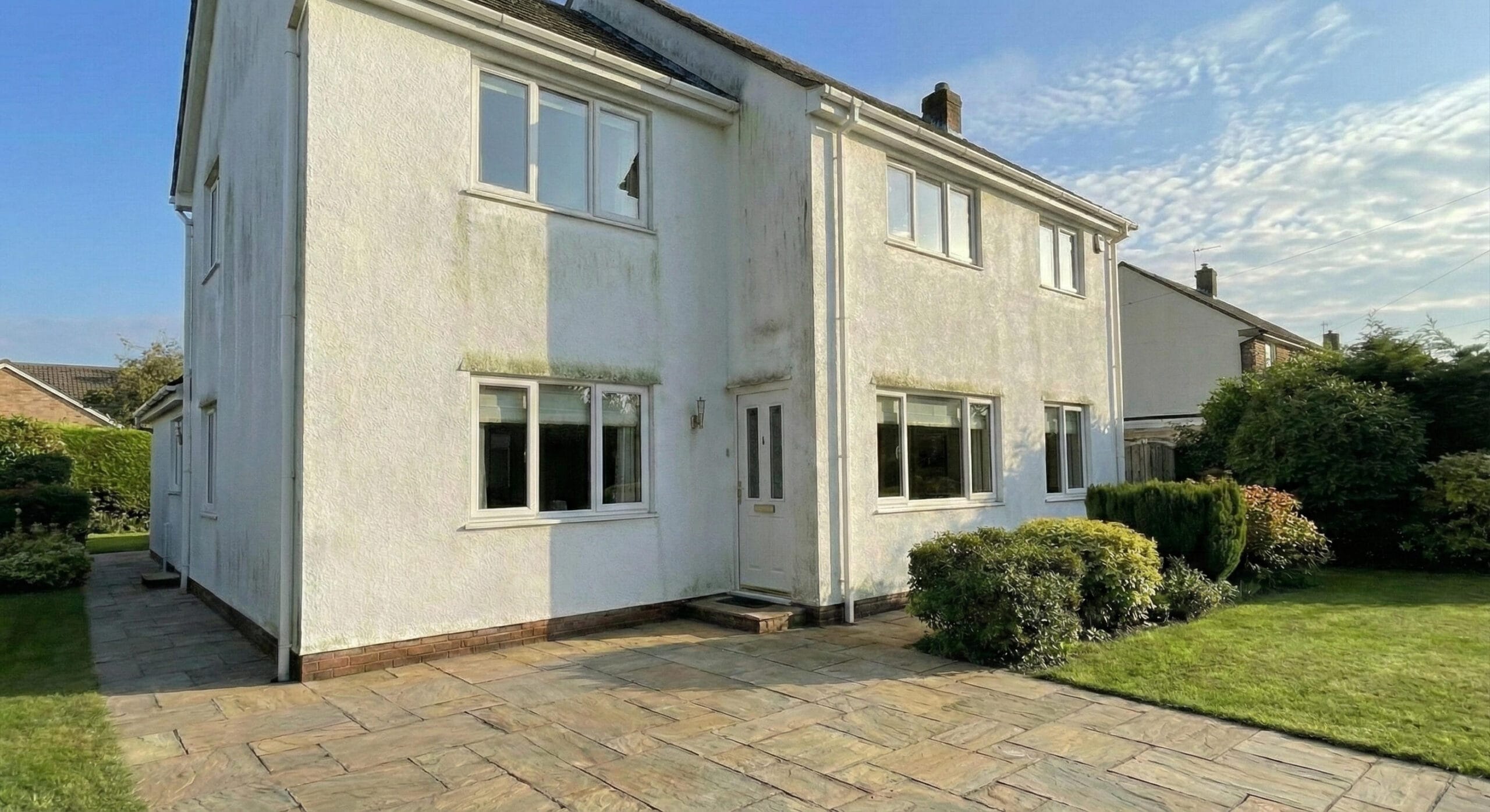 Lincoln block paving gutter before cleaning - moss and weeds